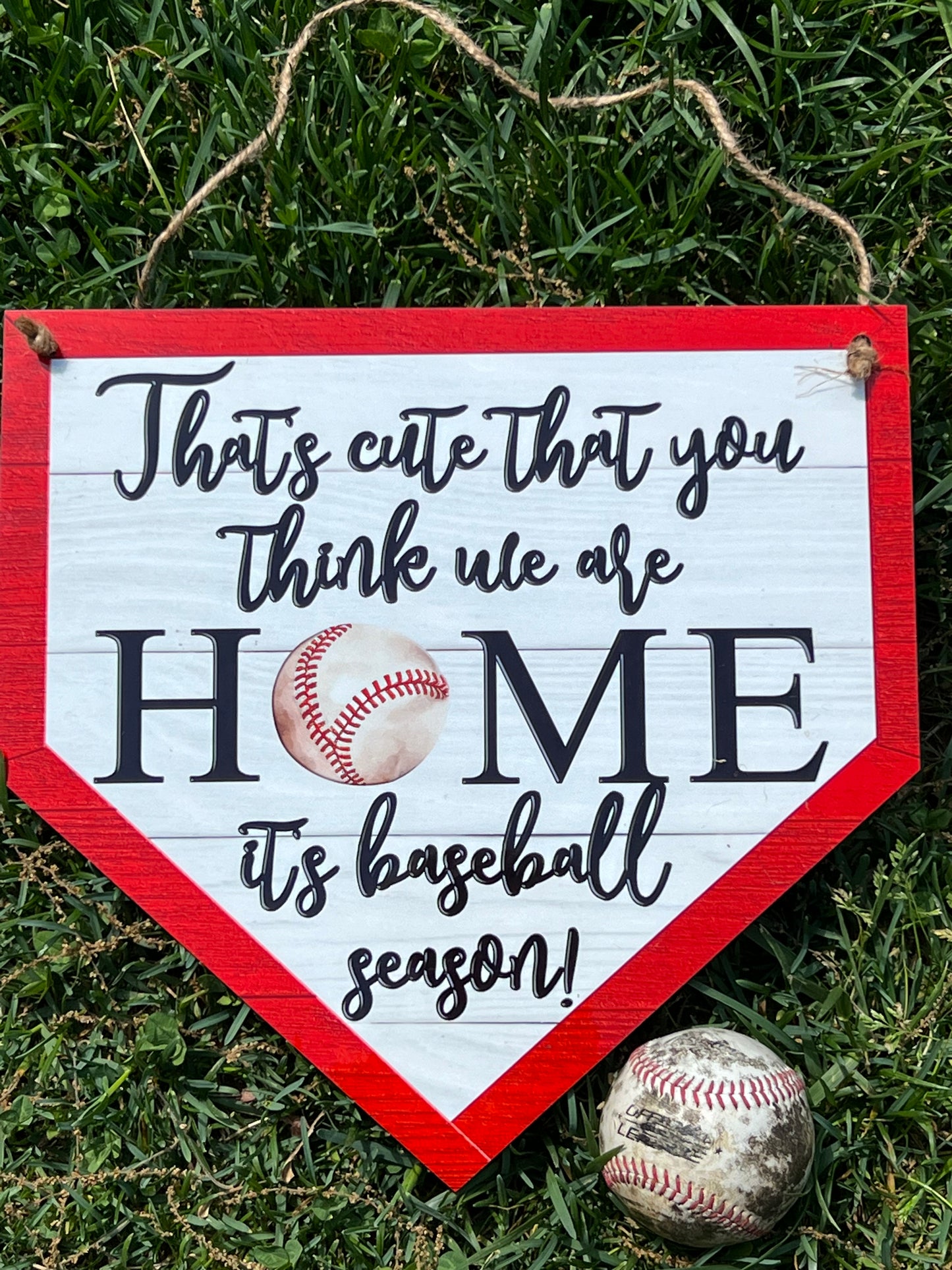 That’s Cute That You Think We Are Home Baseball Door Hanger